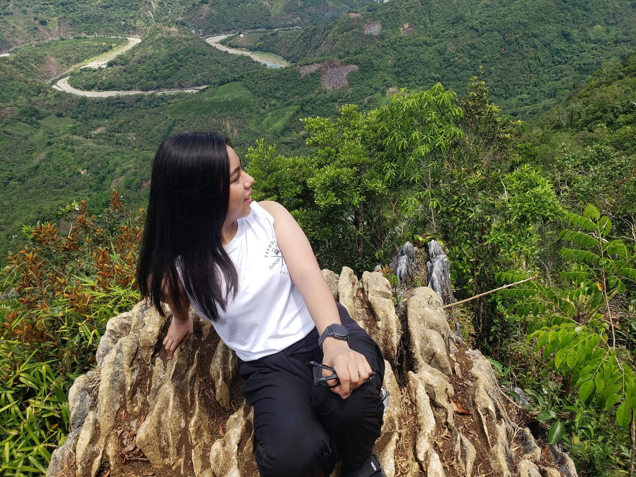 Jahnna hiking among green mountains